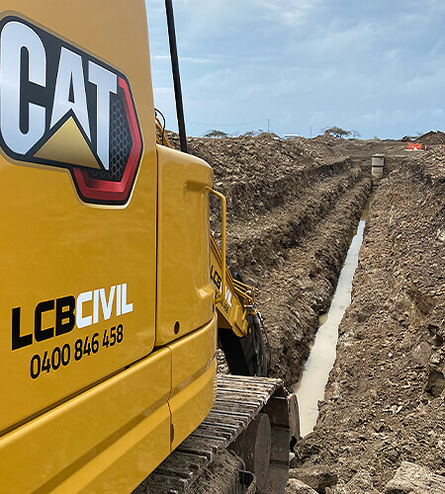 Close up of trench being dug with machinery
